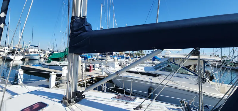 Janice Marie Yacht Photos Pics 2004 Catalina 350 Sloop docked in a marina with other boats under a clear blue sky.