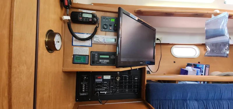 Janice Marie Yacht Photos Pics Interior of a 2004 Catalina 350 Sloop with navigation equipment and control panel.