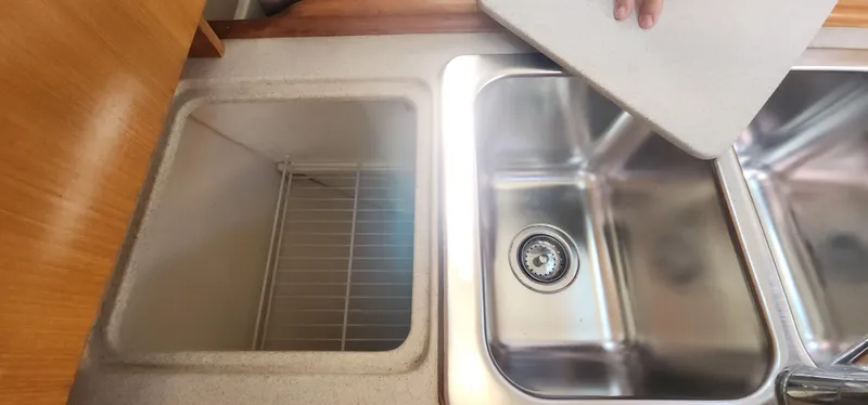 Janice Marie Yacht Photos Pics 2004 Catalina 350 Sloop kitchen sink and storage area with cutting board.