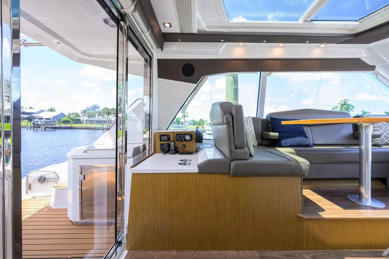 Ajac Cruiser Yacht Photos Pics 2015 Cruisers Cantius yacht interior with modern seating and scenic water view.
