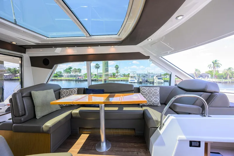 Ajac Cruiser Yacht Photos Pics Luxurious 2015 Cruisers Cantius yacht interior with plush seating and panoramic windows.