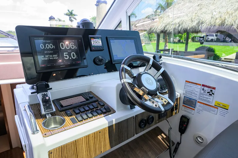 Ajac Cruiser Yacht Photos Pics 2015 Cruisers Cantius helm with modern controls and navigation screens.