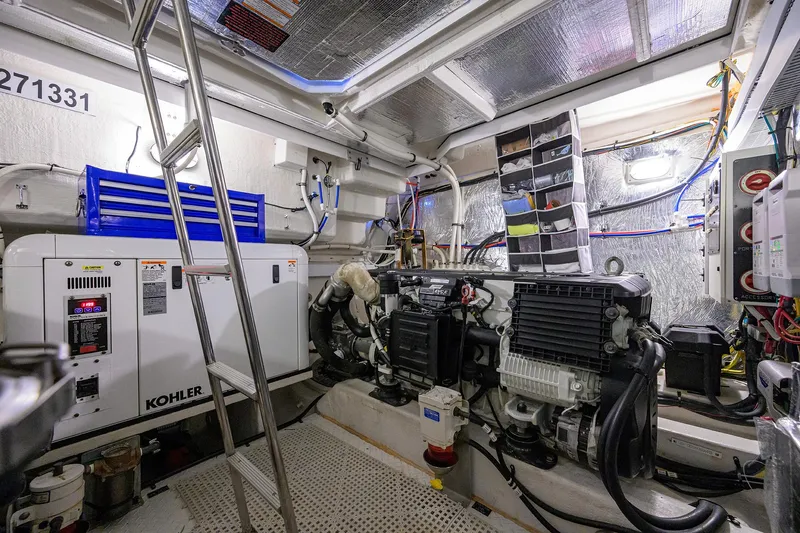 Ajac Cruiser Yacht Photos Pics Engine room of a 2015 Cruisers Cantius yacht with Kohler generator and equipment.