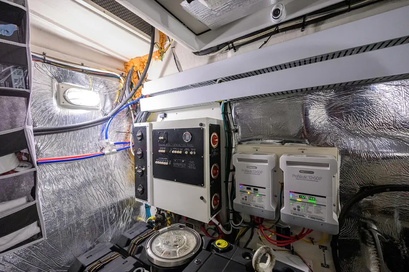 Ajac Cruiser Yacht Photos Pics Engine room of 2015 Cruisers Cantius yacht with control panels and wiring.