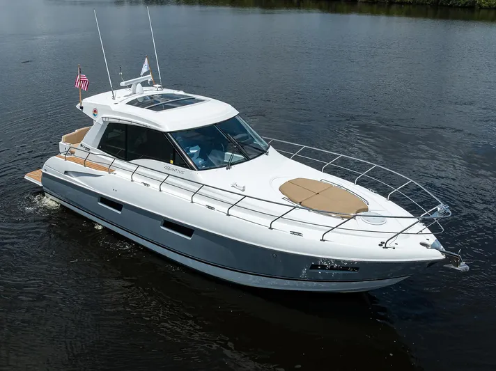 Ajac Cruiser Yacht Photos Pics 2015 Cruisers Cantius yacht cruising on calm water, featuring sleek design and modern amenities.