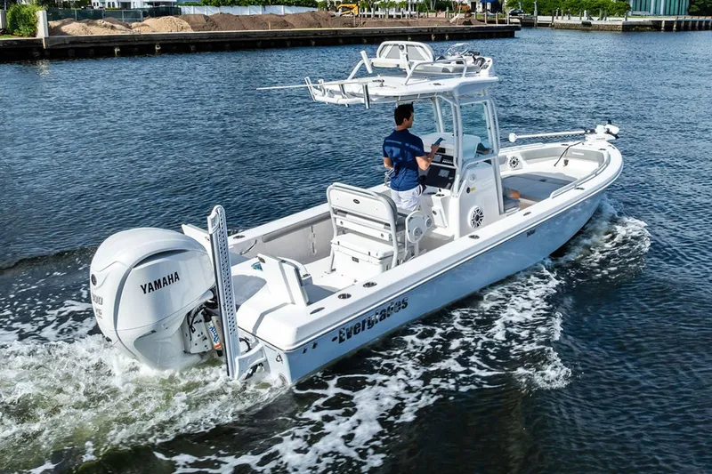  Yacht Photos Pics 2023 Everglades 243 Center Console boat cruising on water with Yamaha engine.