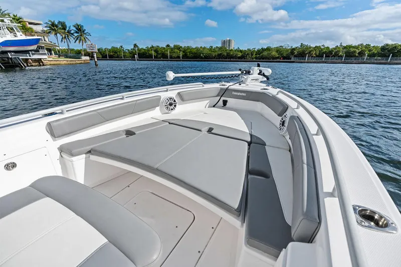  Yacht Photos Pics 2023 Everglades 243 Center Console boat with spacious seating on calm water.