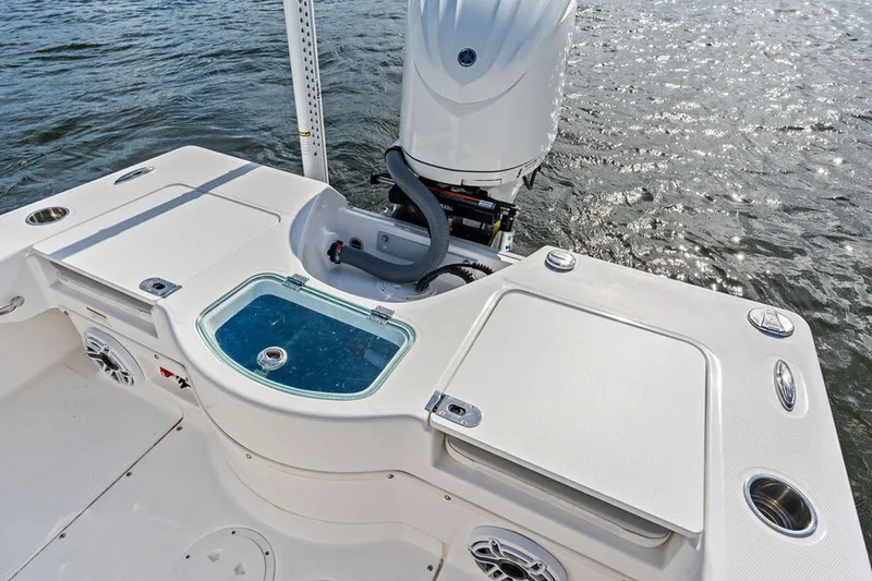  Yacht Photos Pics 2023 Everglades 243 Center Console boat with sleek deck and powerful outboard motor.