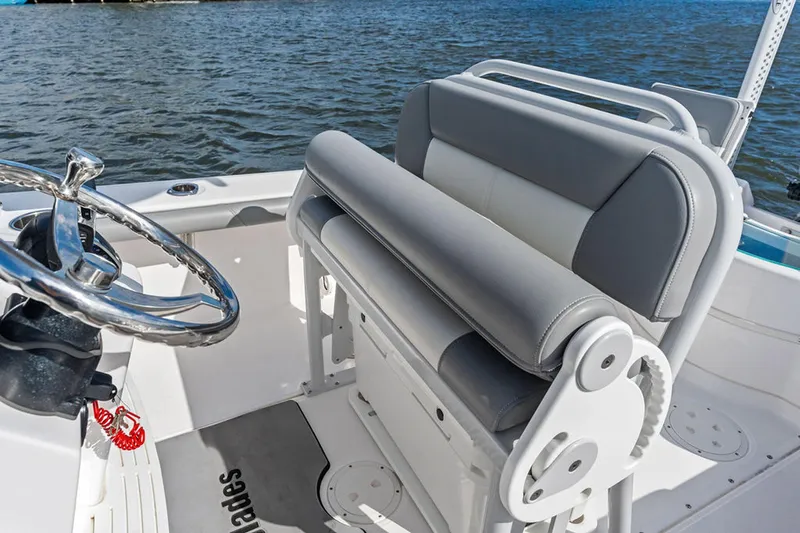  Yacht Photos Pics 2023 Everglades 243 Center Console boat interior with steering wheel and seating.