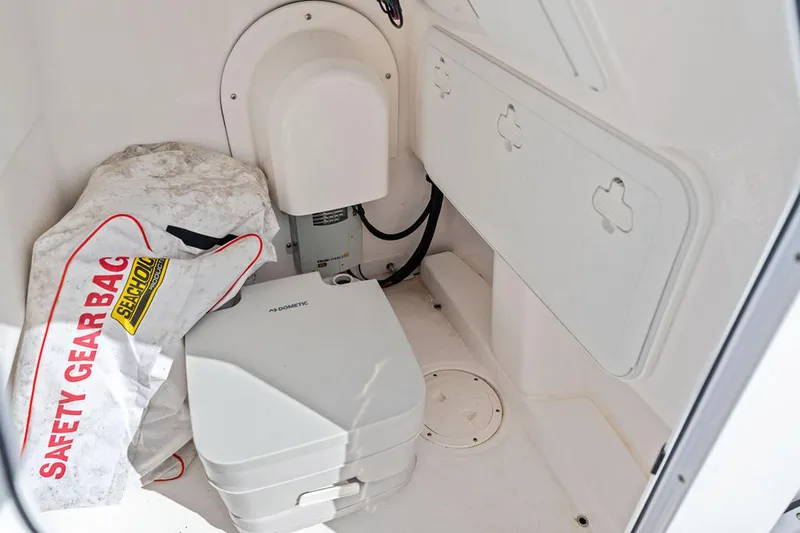  Yacht Photos Pics Interior of 2023 Everglades 243 Center Console with safety gear bag and equipment.