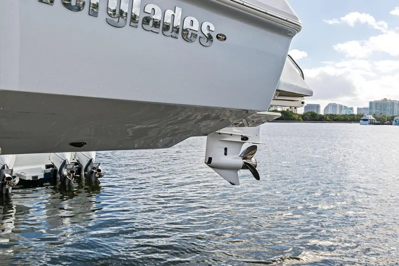  Yacht Photos Pics 2023 Everglades 243 Center Console boat on water, showcasing outboard engines.