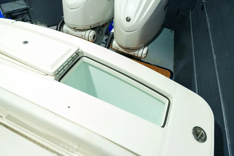  Yacht Photos Pics 2023 Regulator 28 boat with dual outboard engines and storage compartment.