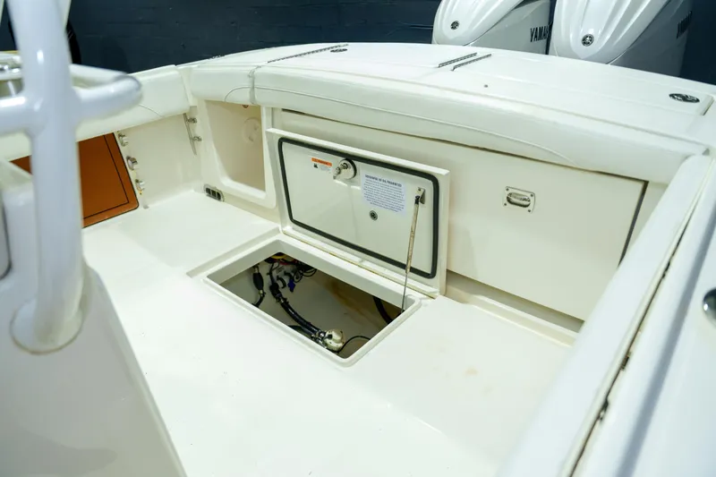  Yacht Photos Pics 2023 Regulator 28 boat interior with storage compartments and Yamaha engines.