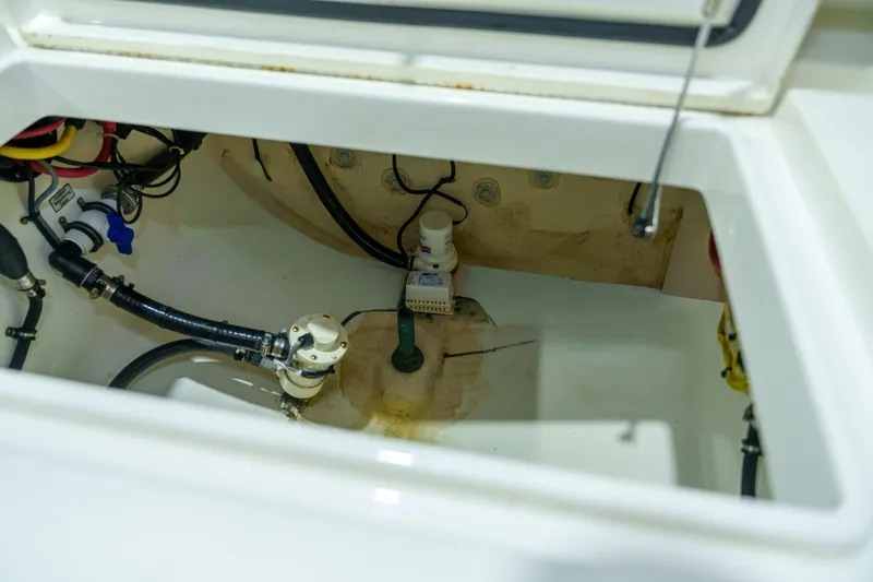  Yacht Photos Pics 2023 Regulator 28 boat interior showing bilge area with wiring and pump system.