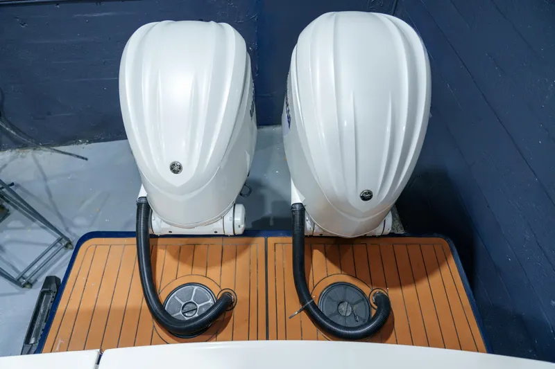  Yacht Photos Pics Twin outboard motors on 2023 Regulator 28 boat, viewed from above.