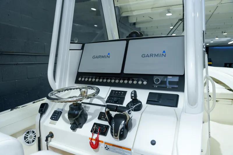  Yacht Photos Pics 2023 Regulator 28 boat dashboard with Garmin navigation displays and controls.