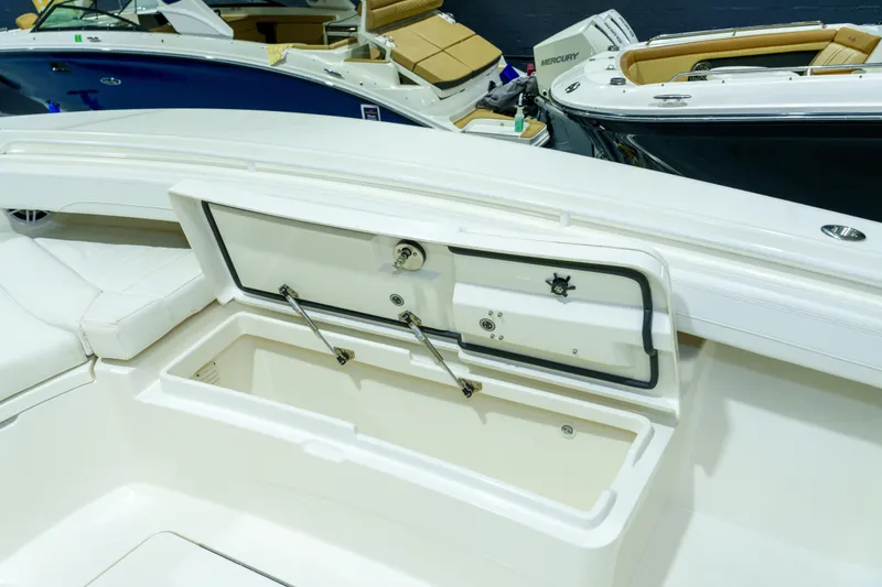  Yacht Photos Pics 2023 Regulator 28 boat interior with open storage compartment, showcasing sleek design.