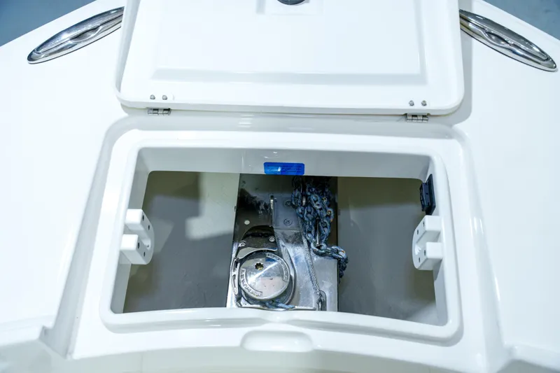  Yacht Photos Pics Open anchor locker on 2023 Regulator 28 boat, showcasing chain storage.