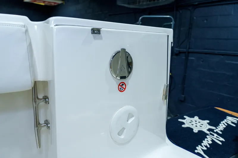  Yacht Photos Pics 2023 Regulator 28 boat interior detail with storage compartment and nautical decor.