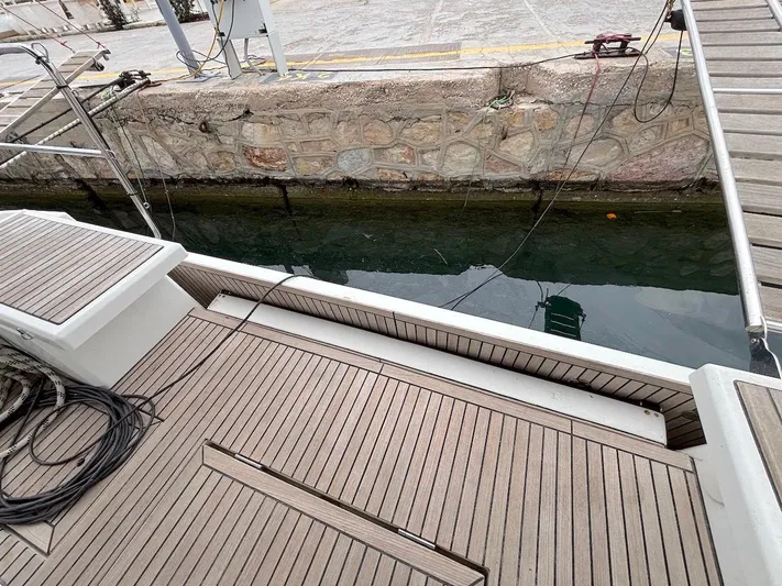 Blue Satellite Yacht Photos Pics Teak deck of 2019 Beneteau Oceanis 46.1 yacht at dockside.