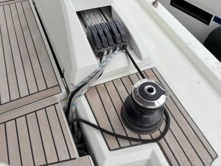 Blue Satellite Yacht Photos Pics Deck of 2019 Beneteau Oceanis 46.1 sailboat with winch and rope clutches.
