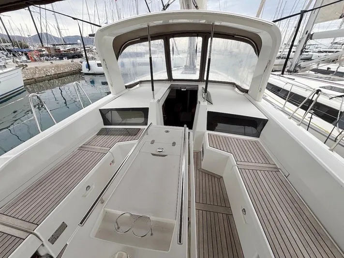 Blue Satellite Yacht Photos Pics 2019 Beneteau Oceanis 46.1 yacht cockpit with teak flooring and spacious seating.