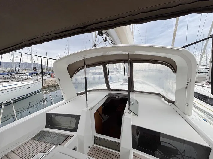 Blue Satellite Yacht Photos Pics 2019 Beneteau Oceanis 46.1 yacht cockpit with sleek design and marina view.