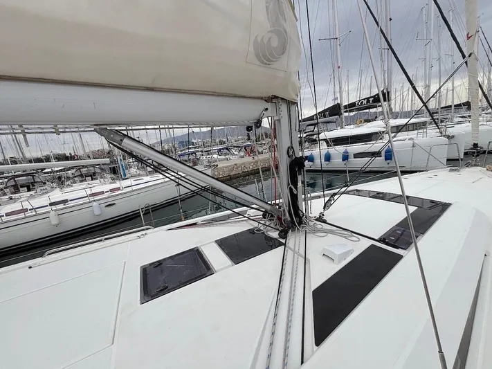 Blue Satellite Yacht Photos Pics 2019 Beneteau Oceanis 46.1 sailboat deck with rigging and marina view.