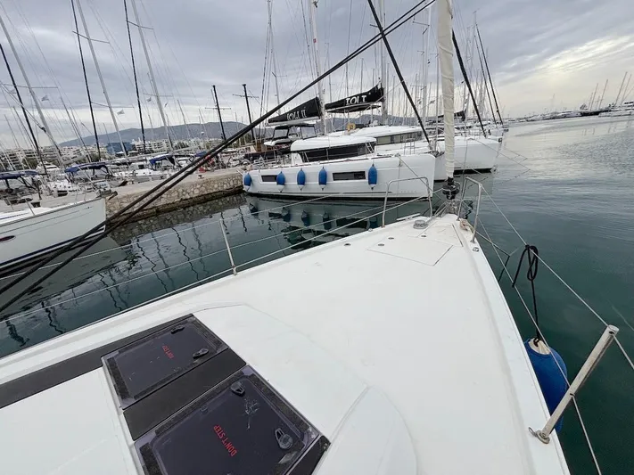 Blue Satellite Yacht Photos Pics Beneteau Oceanis 46.1 sailboat docked in a marina, 2019 model, overcast sky.