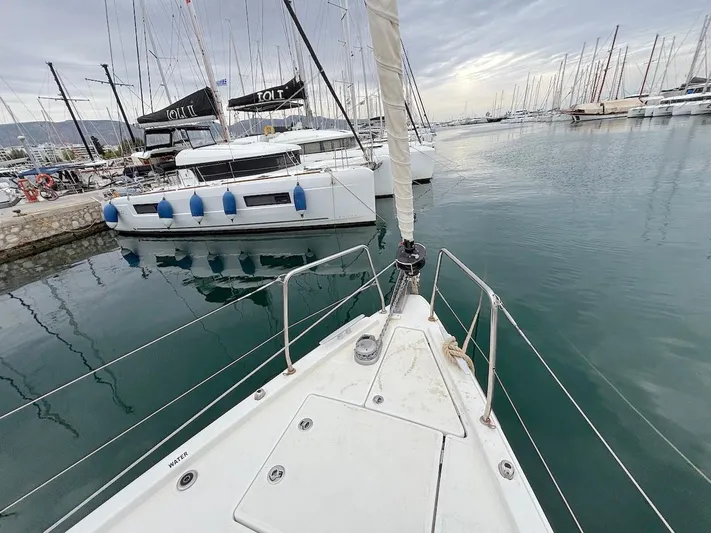 Blue Satellite Yacht Photos Pics Bow view of 2019 Beneteau Oceanis 46.1 yacht docked in a marina.