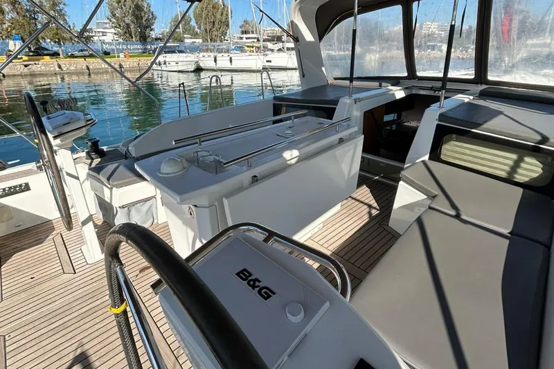 Blue Satellite Yacht Photos Pics 2019 Beneteau Oceanis 46.1 yacht cockpit with modern seating and steering wheel.