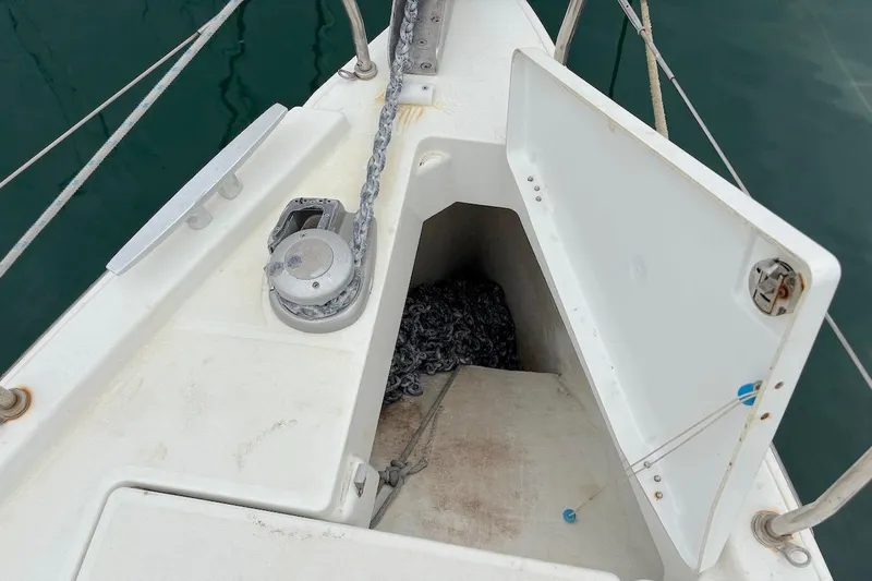 Blue Satellite Yacht Photos Pics Anchor locker of 2019 Beneteau Oceanis 46.1 sailboat with chain and windlass.