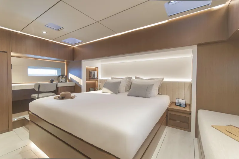 Savoir Faire Yacht Photos Pics Luxurious bedroom interior of 2025 MCP Yachts GLOBAL EXP 68, featuring modern design and elegant furnishings.