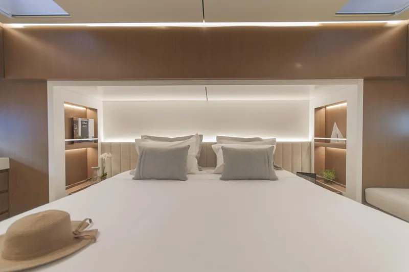Savoir Faire Yacht Photos Pics Luxurious bedroom interior of 2025 MCP Yachts GLOBAL EXP 68, featuring elegant design and ambient lighting.