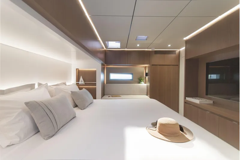 Savoir Faire Yacht Photos Pics Luxurious bedroom interior of 2025 MCP Yachts GLOBAL EXP 68, featuring modern design and elegant furnishings.