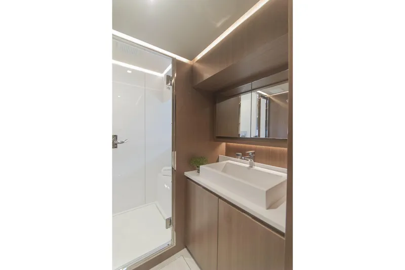 Savoir Faire Yacht Photos Pics Luxurious bathroom in 2025 MCP Yachts GLOBAL EXP 68, featuring modern fixtures and elegant design.