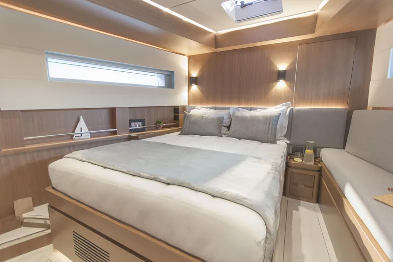 Savoir Faire Yacht Photos Pics Luxurious bedroom interior of 2025 MCP Yachts GLOBAL EXP 68, featuring modern design and cozy lighting.