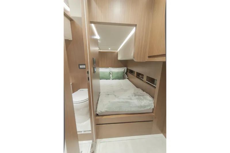 Savoir Faire Yacht Photos Pics Luxurious cabin interior of 2025 MCP Yachts GLOBAL EXP 68 with modern wood finish.