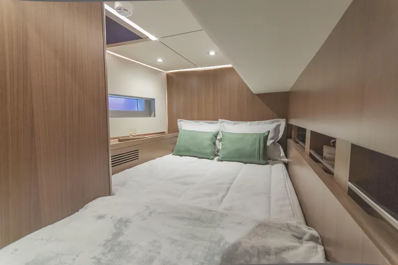 Savoir Faire Yacht Photos Pics Luxurious cabin interior of 2025 MCP Yachts GLOBAL EXP 68 with modern design and cozy bedding.