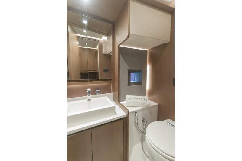 Savoir Faire Yacht Photos Pics Luxurious bathroom in 2025 MCP Yachts GLOBAL EXP 68, featuring modern fixtures and elegant design.
