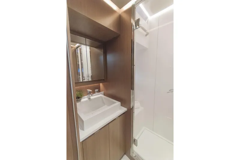 Savoir Faire Yacht Photos Pics Luxury bathroom in 2025 MCP Yachts GLOBAL EXP 68, featuring modern sink and shower.
