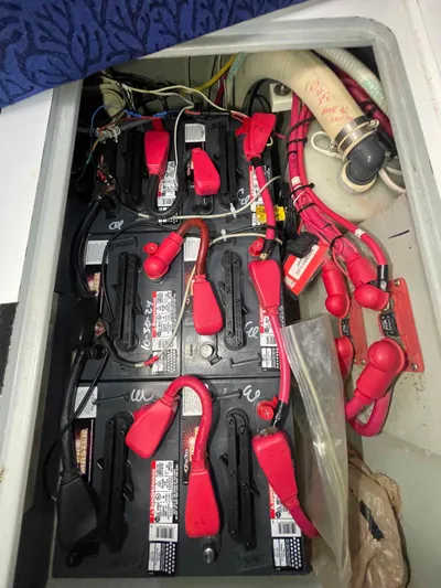 Galileo Yacht Photos Pics Battery compartment of a 2000 Manta 42 Catamaran with red cables and connectors.