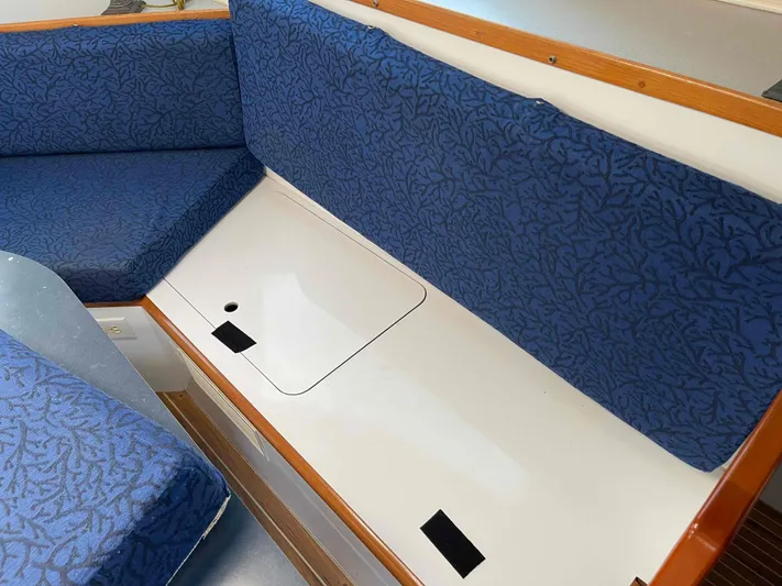 Galileo Yacht Photos Pics Interior seating of 2000 Manta 42 Catamaran with blue patterned cushions.