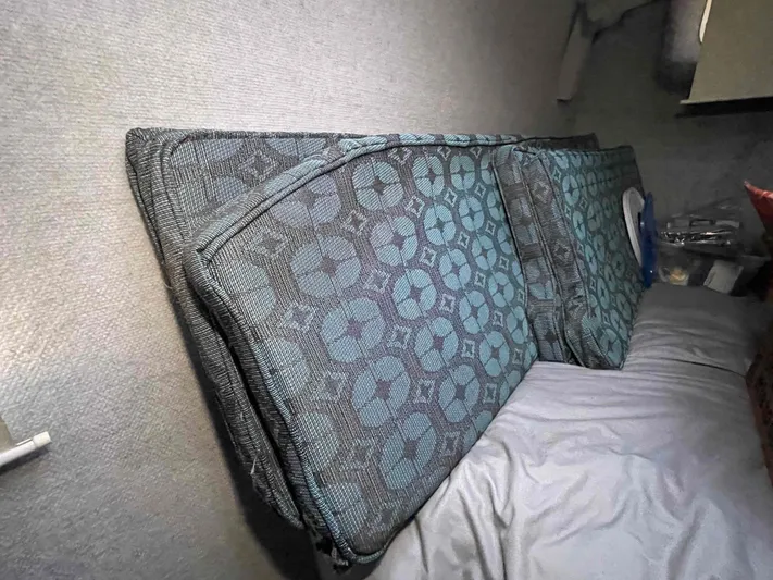 Galileo Yacht Photos Pics Cushions with geometric patterns inside a 2000 Manta 42 Catamaran cabin.