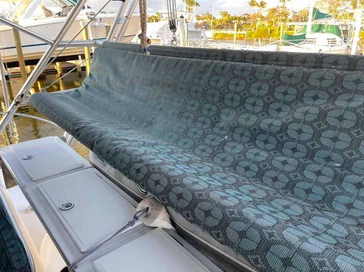 Galileo Yacht Photos Pics Manta 42 Catamaran 2000 with patterned cover, docked at marina, sunny day.