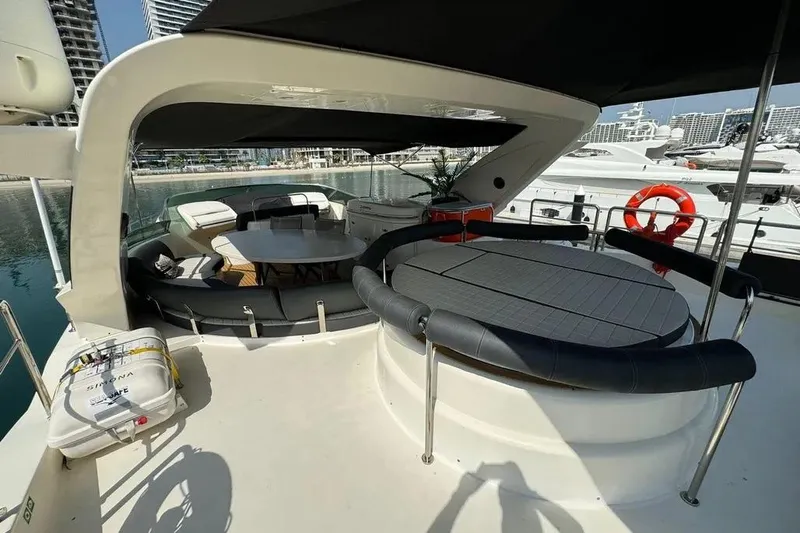  Yacht Photos Pics Luxurious 2003 Azimut 98 Leonardo yacht deck with seating and dining area.