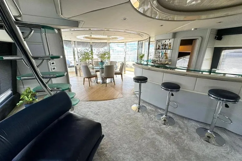  Yacht Photos Pics Luxurious interior of 2003 Azimut 98 Leonardo yacht with bar and dining area.