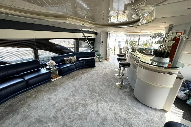  Yacht Photos Pics Luxurious interior of 2003 Azimut 98 Leonardo yacht with elegant seating and modern bar area.