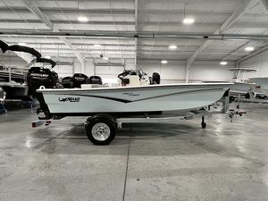 2023 Mako Pro Skiff 13 CC boat on trailer in showroom.