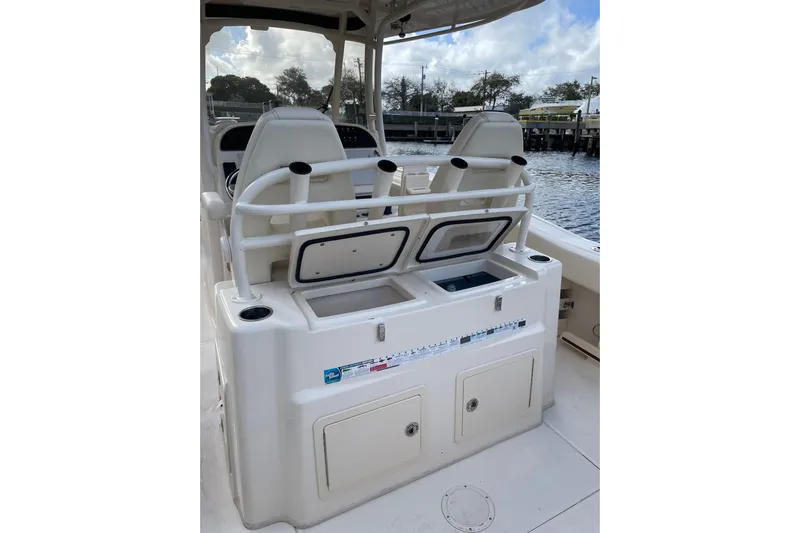  Yacht Photos Pics 2023 Grady-White Canyon 306 boat interior with seating and storage compartments.